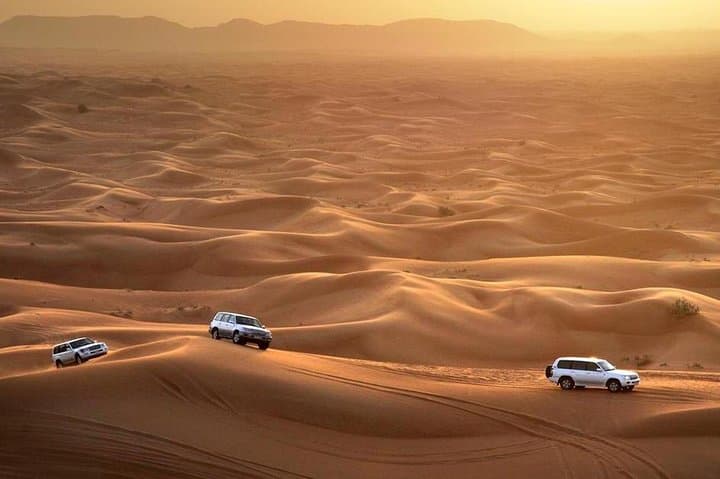 Dubai desert safari with dune bashing, camel ride, and BBQ dinner — Adventure things to do in Dubai